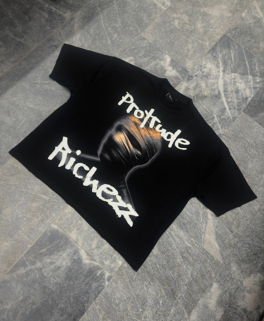 Signature embroidered “Protrude Richezz” tee