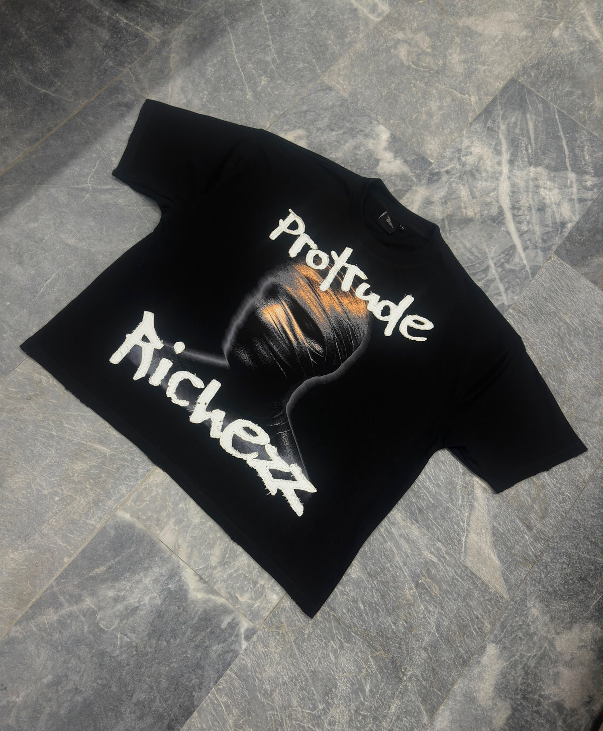 Signature embroidered “Protrude Richezz” tee