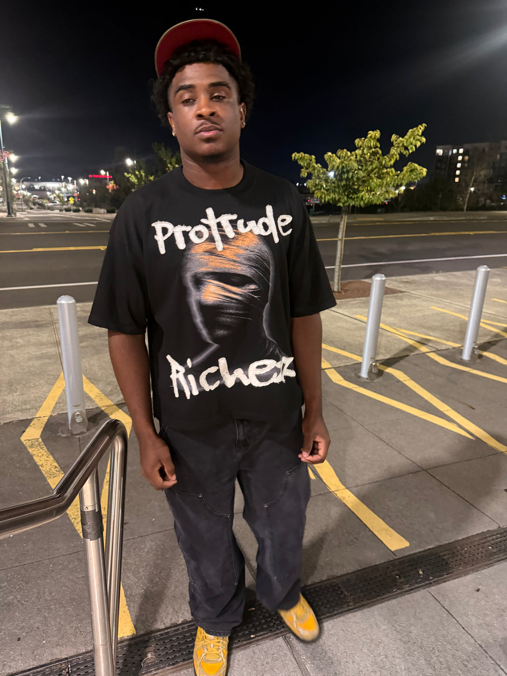 Signature embroidered “Protrude Richezz” tee
