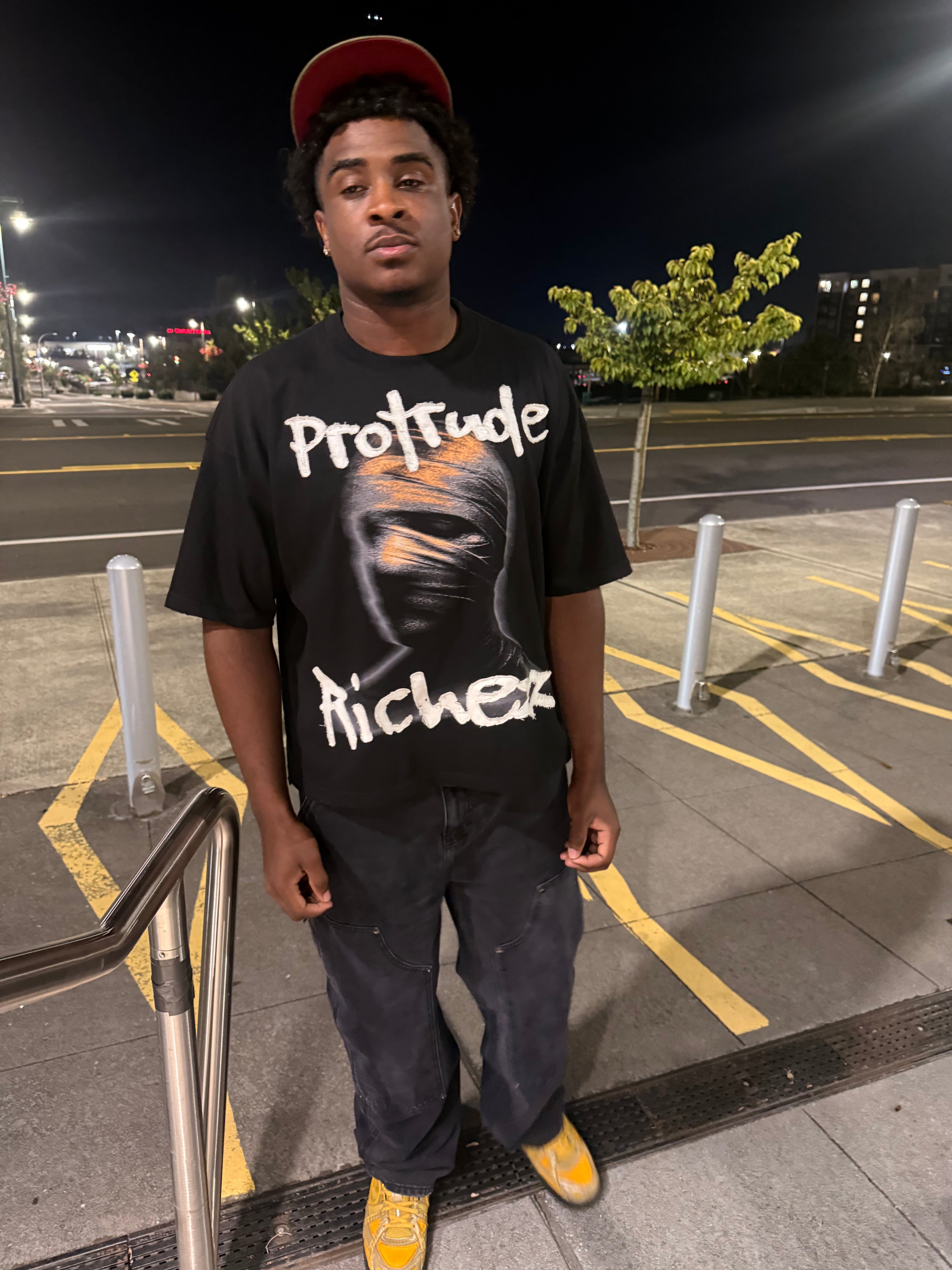 Signature embroidered “Protrude Richezz” tee